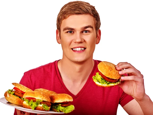 Mann isst große Hamburger. — Stockfoto