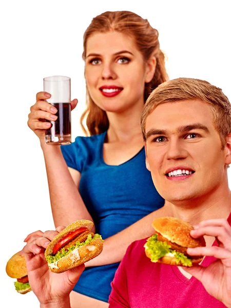 Homem e mulher comendo sanduíche grande com cola. Isolados . — Fotografia de Stock