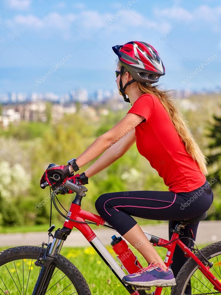 Bikes cycling girl wearing helmet. Stock Photo by ©poznyakov 114084174