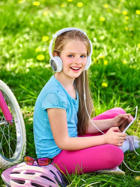 Bikes cycling girl wearing helmet watching at tablet pc . — Stock Photo, Image