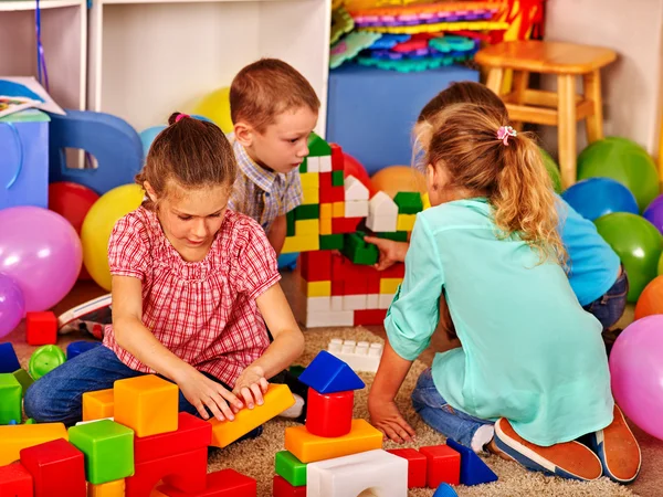 Group children game blocks on floor . — Stock Photo, Image