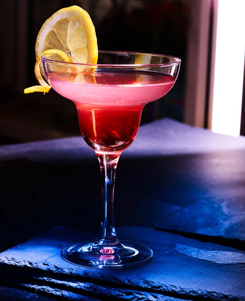 Pomegranate cocktail on black background — Stock Photo, Image