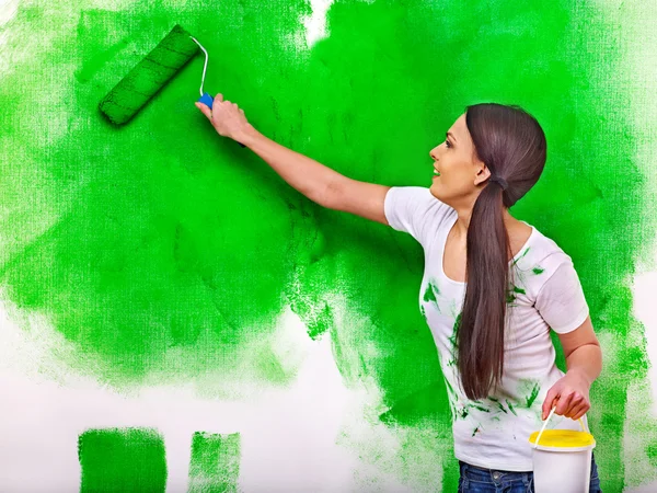 Woman paint wall at home. — Stock Photo, Image