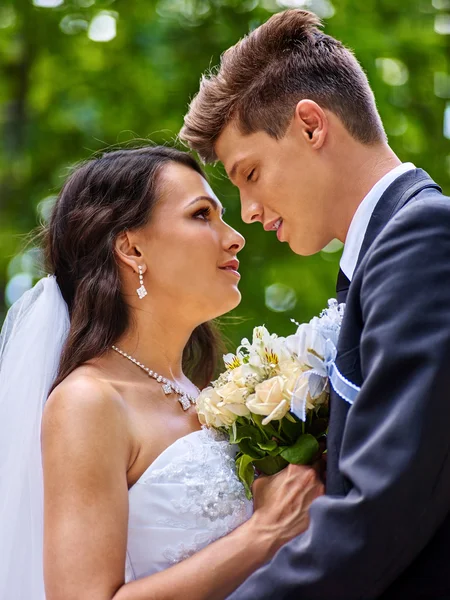 Groom kissing bride. — Stock Photo, Image