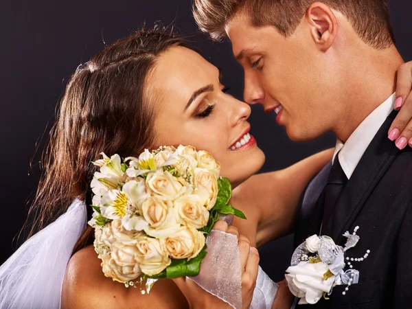 Groom embracing bride . — Stock Photo, Image