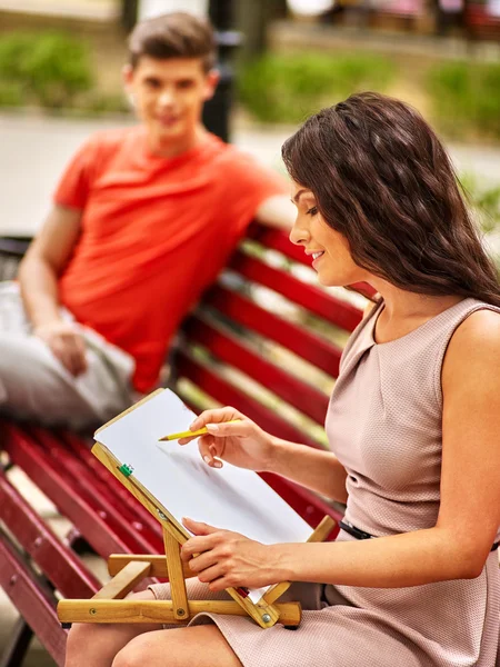 Couple  at park on bench. — Stock Photo, Image