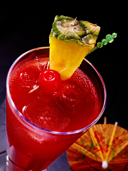 Pineapple red  cocktail with cherry and umbrella — Stock Photo, Image