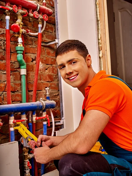 Men builder fixing heating system . — Stock Photo, Image