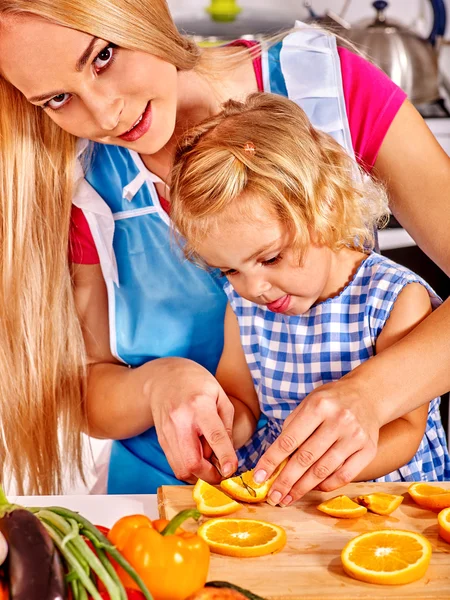 Mother and child cooking at kitchen. — Stock Photo, Image