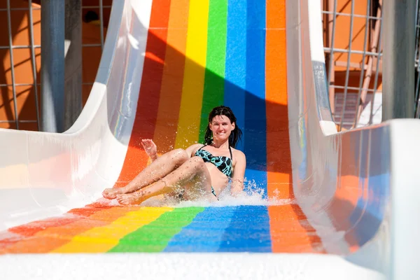 Woman in bikini sliding water park. — Stock Photo, Image