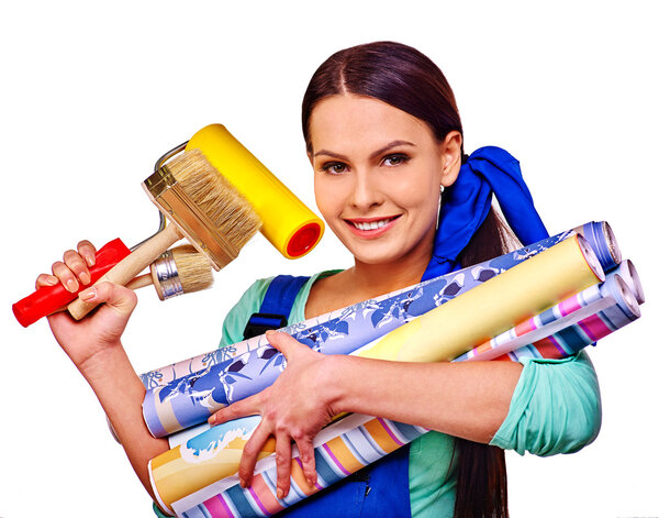 Builder woman with wallpapers. Royalty Free Stock Photos