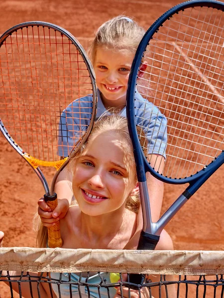 Two sisters girls athlete  with rackets — Stock Photo, Image