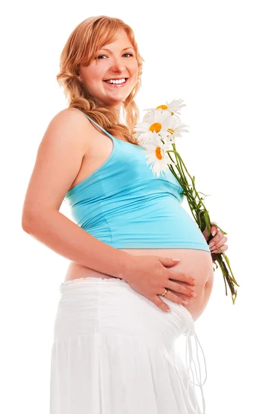 Pregnant woman with flowers. — Stock Photo, Image