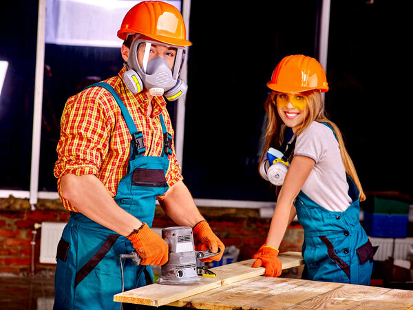 People in builder helmets .