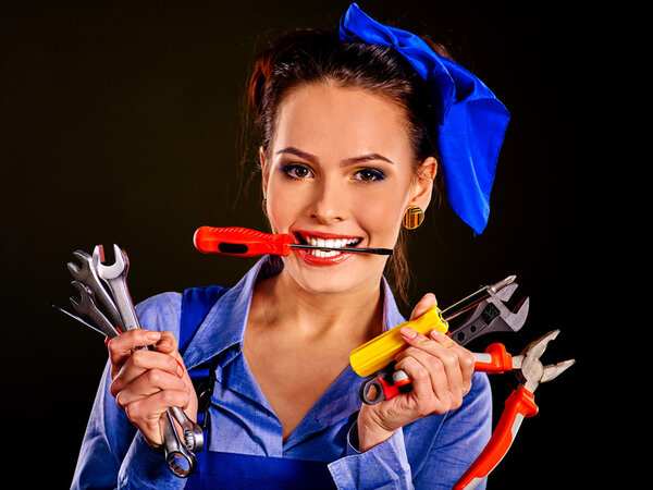 Woman builder with construction tools.