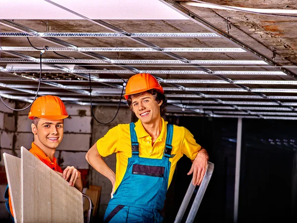 Men installing suspended ceiling — 图库照片