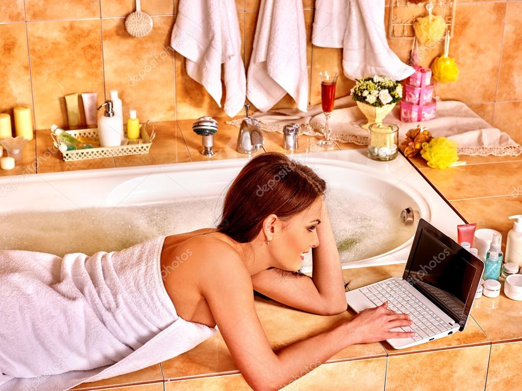 Woman relaxing at home luxury bath.