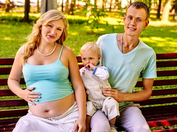 Pregnant woman with family outdoor. — Stock Photo, Image