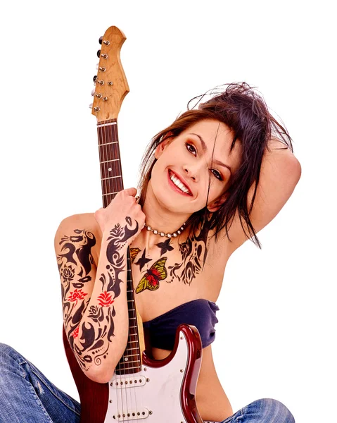 Girl with tattoo playing guitar. — Stock Photo, Image