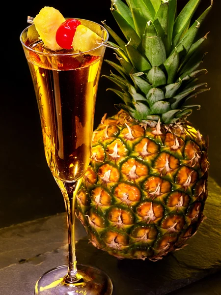 Champagne cocktail with cherry and pineapple — Stock Photo, Image