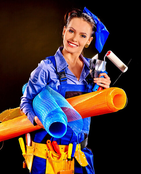 Woman builder with construction tools.