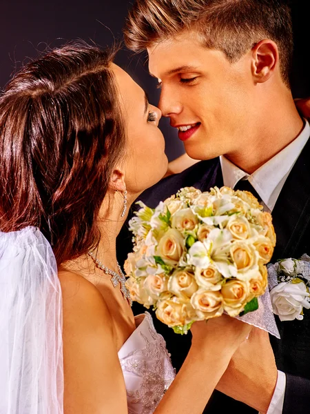 Groom embracing bride . — Stock Photo, Image