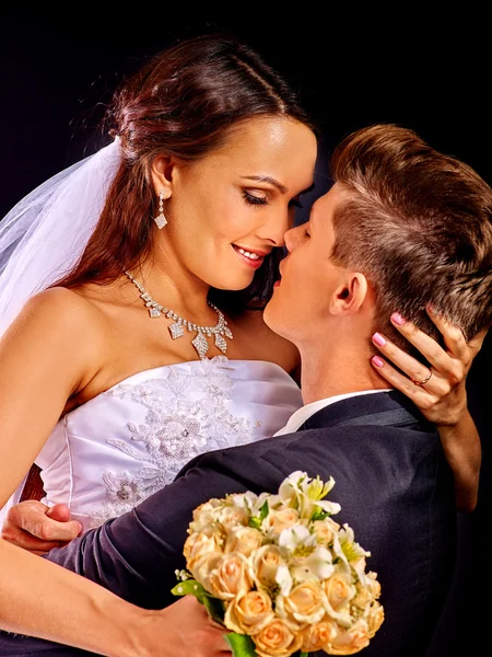 Groom embracing bride . — Stock Photo, Image