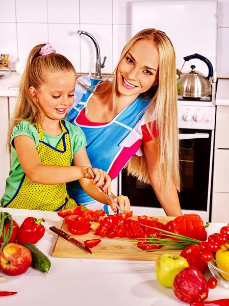 Mother and daughter cook at kitchen. — Stock Photo, Image