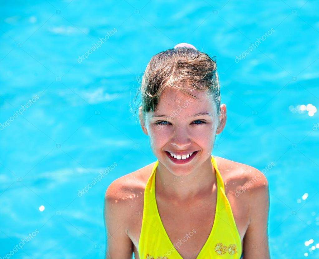 Kid in yellow bikini in swimming pool Stock Photo by ©poznyakov 78140582