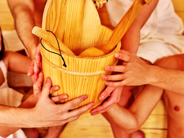 Sauna bucket  holding by group people. — Stock Photo, Image