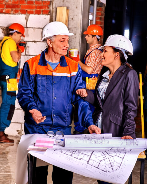 Business woman in builder helmet .