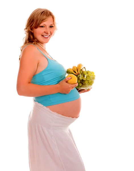 Mujer embarazada comiendo vegetales . — Foto de Stock