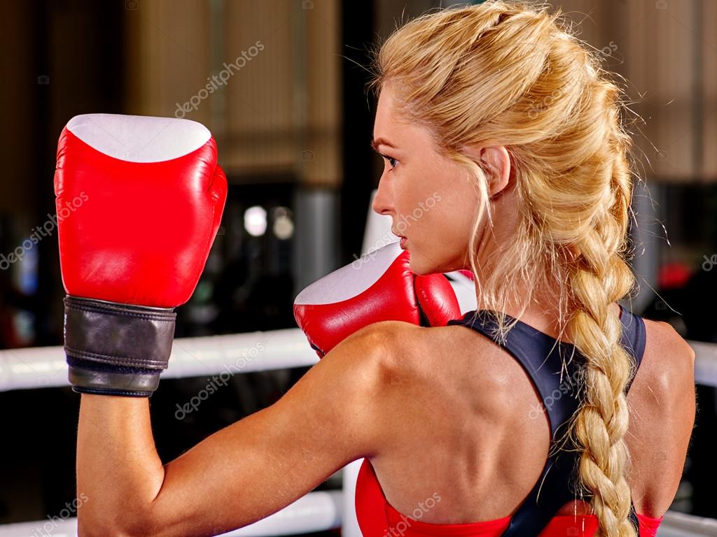 Portrait of sport blond girl boxing