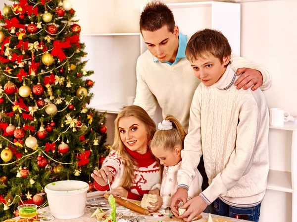 Family with children rolling dough in Xmas kitchen. — Stock Photo, Image