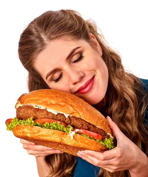 Girl eating big sandwich. Isolated. — Stock Photo, Image