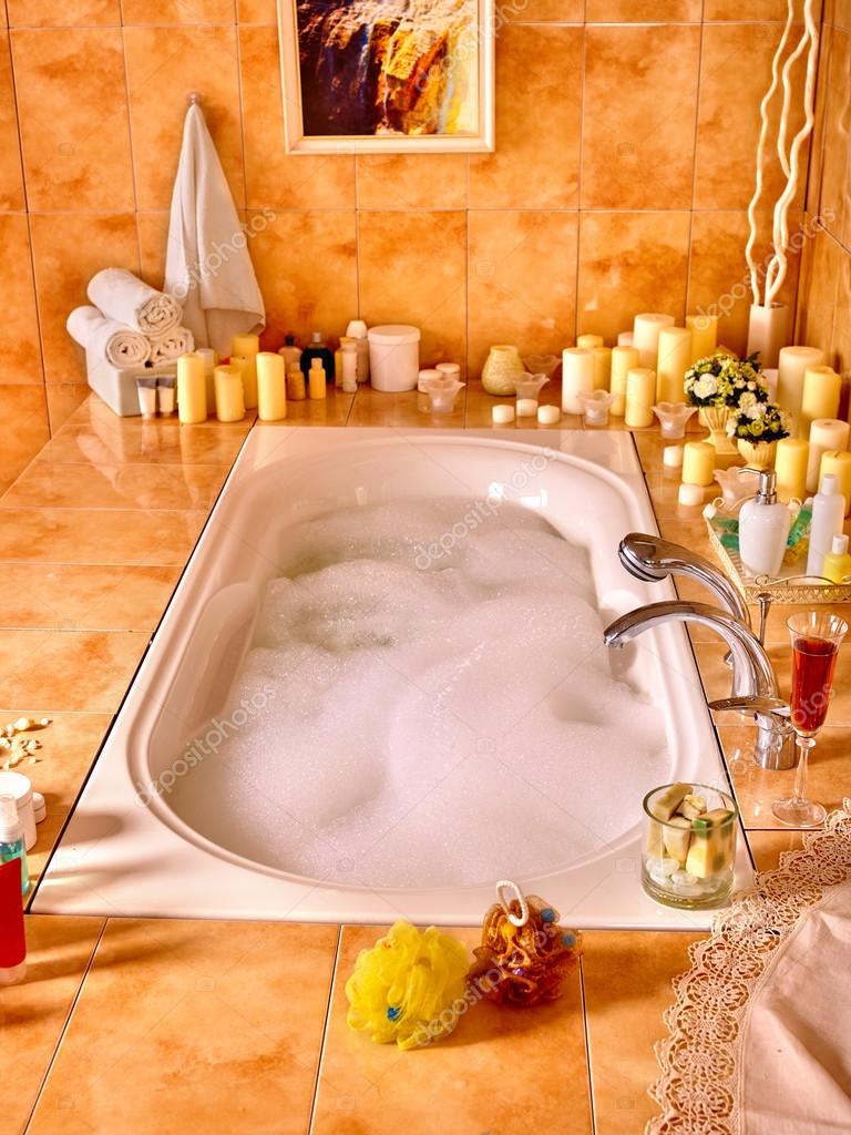 Bathroom interior with bubble bath. — Stock Photo © poznyakov 89975270
