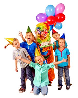 Clown holding cake on birthday with group children. clipart