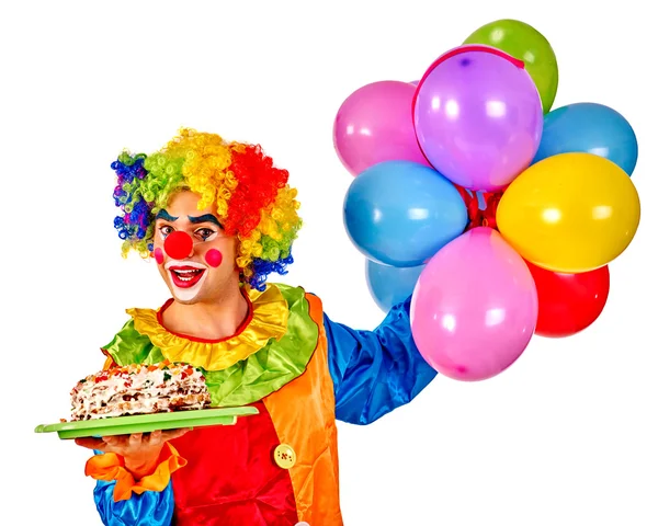 С днем рождения клоун держит кучу шариков . Лицензионные Стоковые Изображения