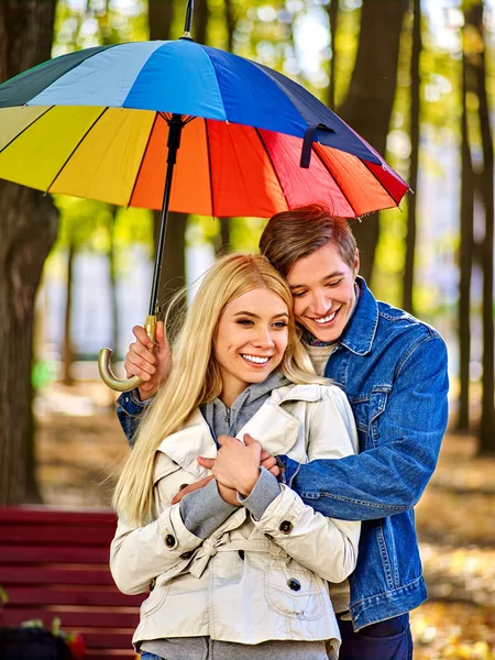 Loving couple on a date under umbrella. — Stock Photo, Image