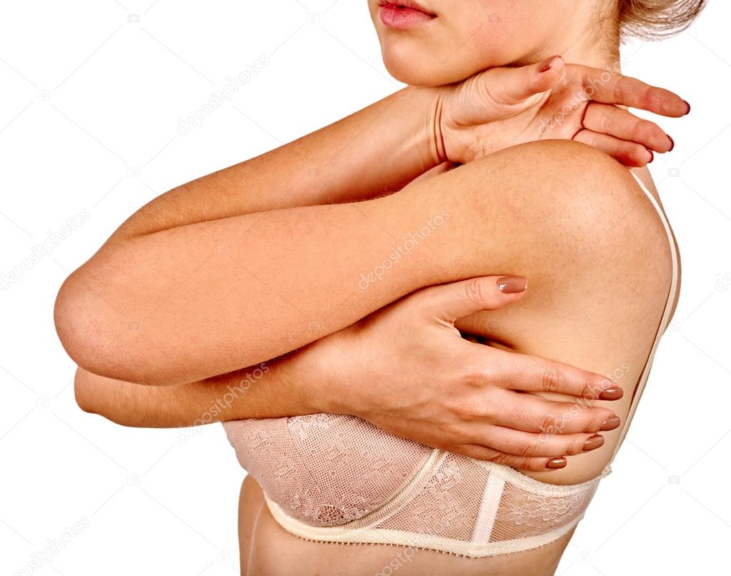 Woman hugging breasts