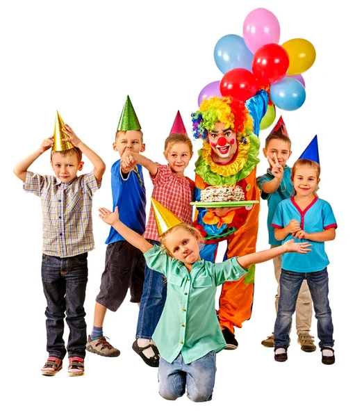 Clown holding cake and children — Stock Photo, Image