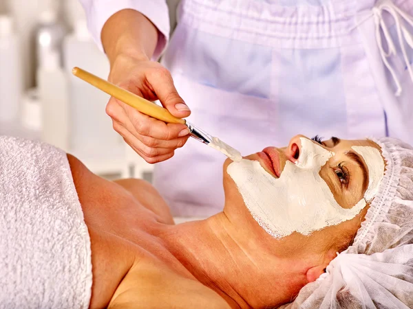 Woman take facial mask — Stock Photo, Image