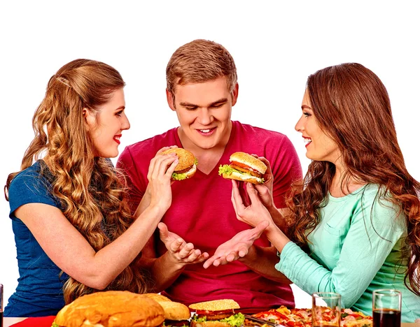 Group of people eating hamburgers — Stock Photo, Image