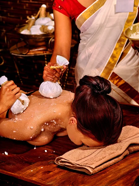 Woman having massage with pouch. — Stock Photo, Image