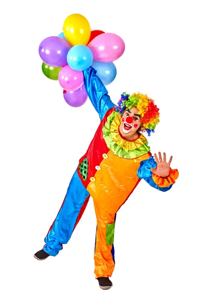 Gelukkige verjaardag clown houden van een bos van ballonnen. — Stockfoto