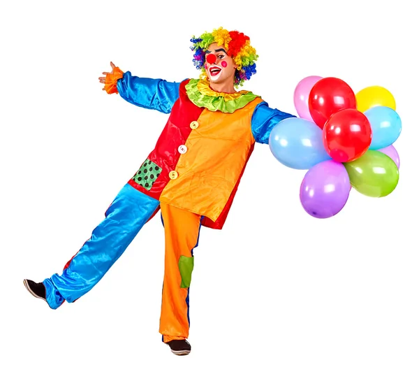 Happy birthday clown holding a bunch of balloons. — Stock Photo, Image