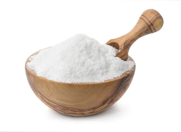 Wood bowl full of cooking salt with scoop — Stock Photo, Image