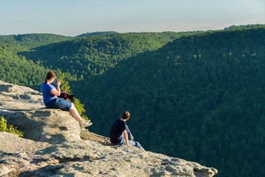 Hikers on Raven Rock in Coopers Rock State Forest WV