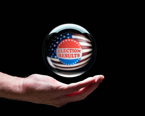 Hand holding a crystal glass forecasting ball to predict the result of the election — Stock Photo, Image