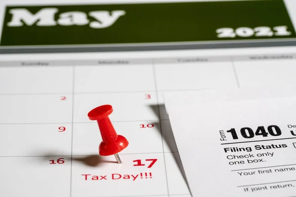 Tax Day concept for May 17 2021 using calendar and note